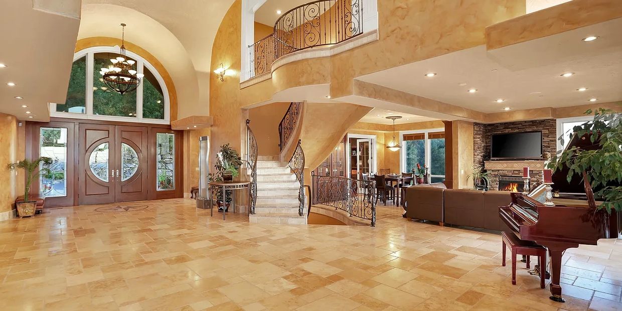 Interior architectural of a home with a non standard staircase.