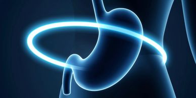 Glowing ring encircles a stomach illustration.