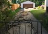 BEFORE: Ripping out the old asphalt driveway.