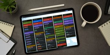 Tablet showing Trello board on desktop