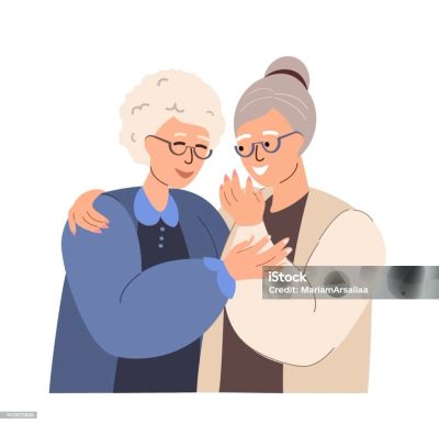 Two elderly women sharing a warm, affectionate moment.