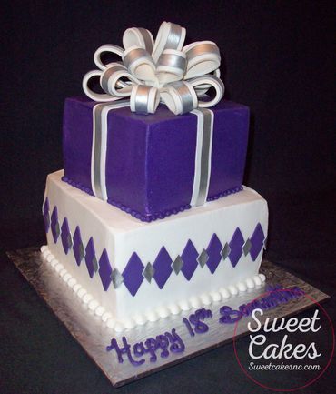 2-tier square buttercream iced cake with fondant stripes, diamonds & bow.