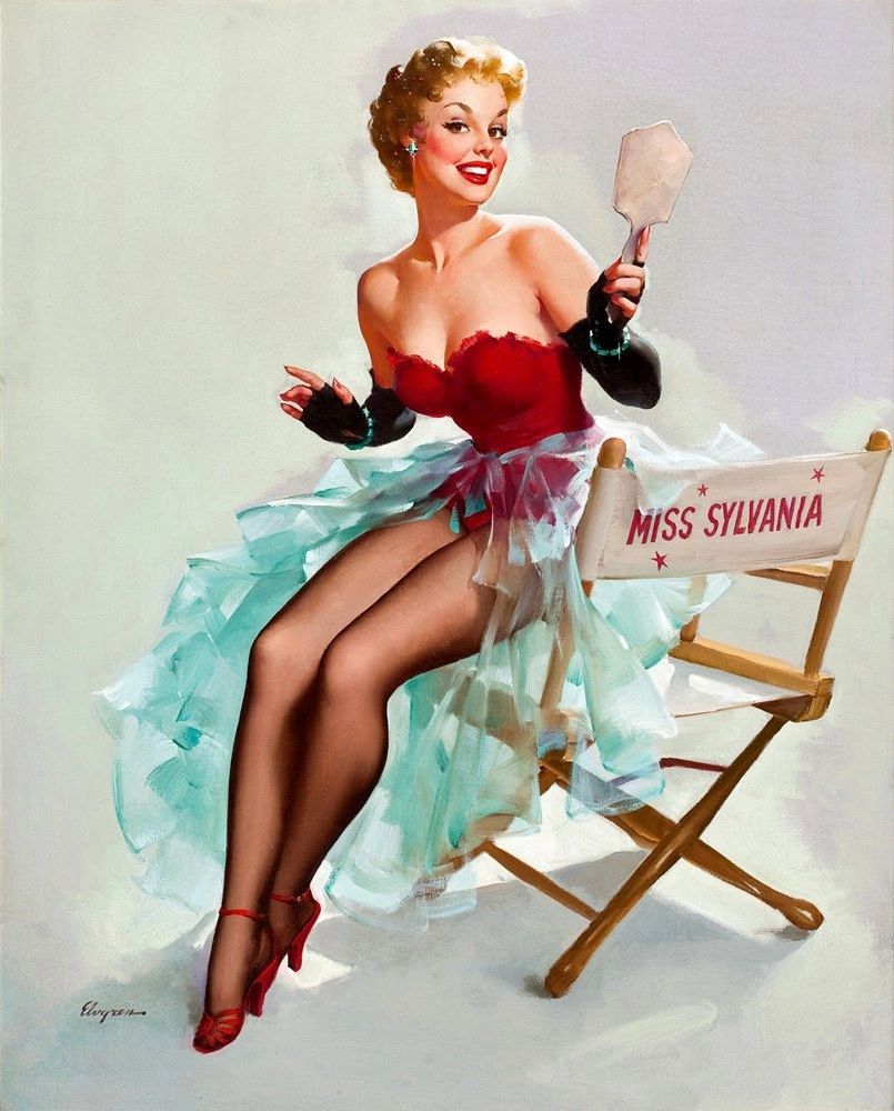 Pin-up girl in red dress posing with mirror.