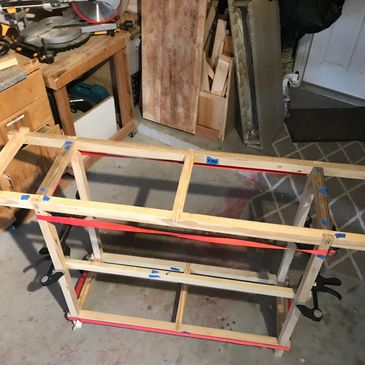 Mortise and tenon joins combined with half lap dovetail cross braces.  Reclaimed aged pine frame. Fi