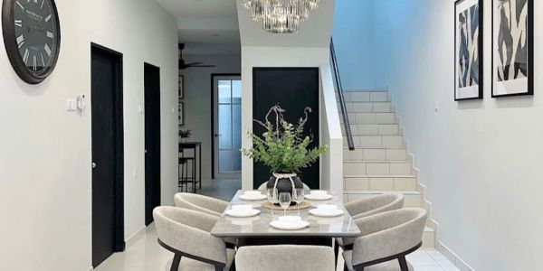 Modern dining room with elegant chandelier and neutral tones.