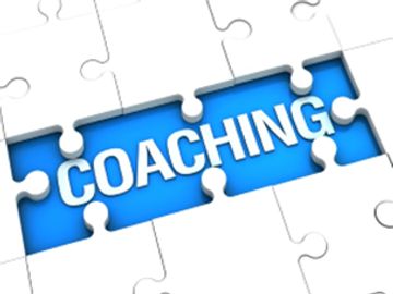 Puzzle showing the word 'COACHING' revealed.