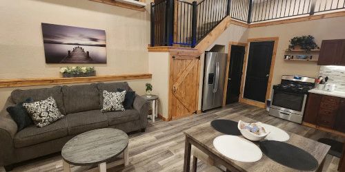 Living Room and Kitchen with dining table and couch. 