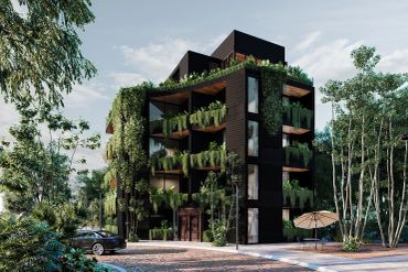 Edificio moderno con jardines verticales y balcones con plantas.