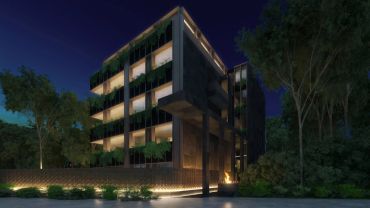 Edificio moderno iluminado por la noche.