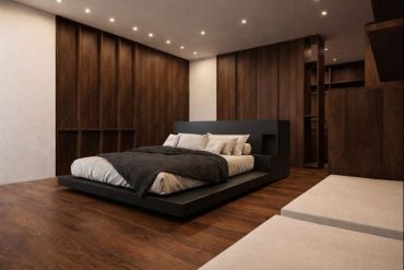 Dormitorio moderno con cama baja y tonos oscuros de madera.