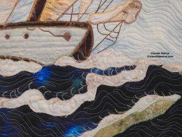 Detail of a ketch in choppy seas with the sails billowing out. 
