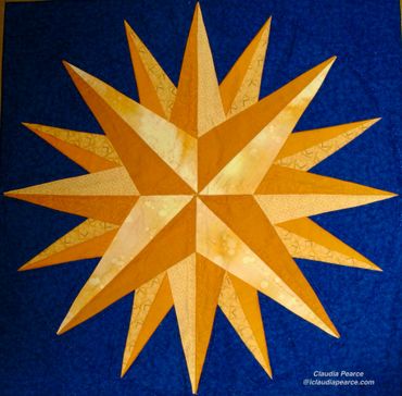 Gold mariner's compass block on blue background