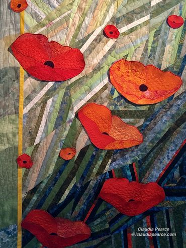 field of green with individual poppy quilts