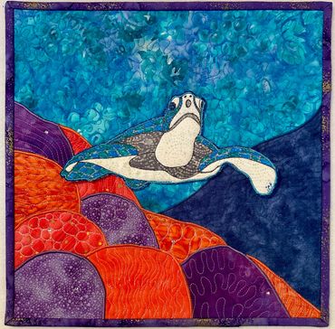 Turtle over a reef