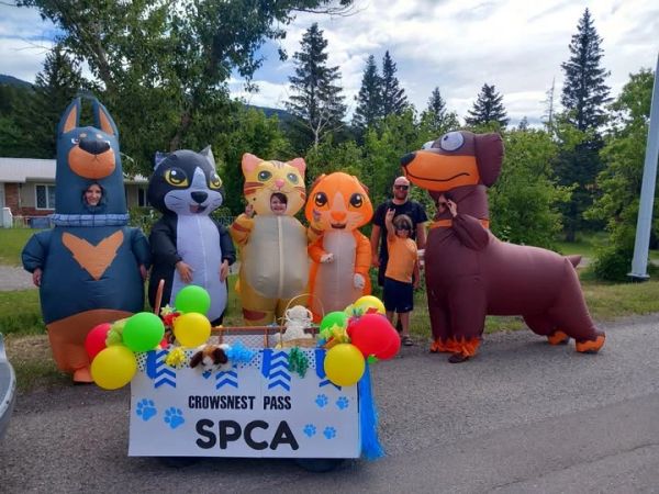 Group in animal costumes at a SPCA event.
