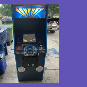 Vintage Journey arcade game in a garage.