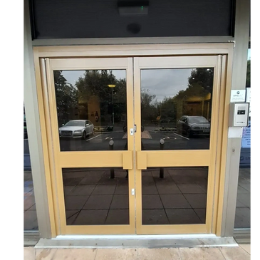 Aluminium entrance door installed by Sentry Automation