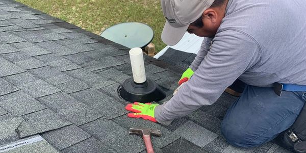Dylan Gunn working on roof repair in Augusta