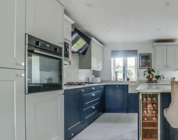 Kitchen cabinets before navy & grey island worktops 