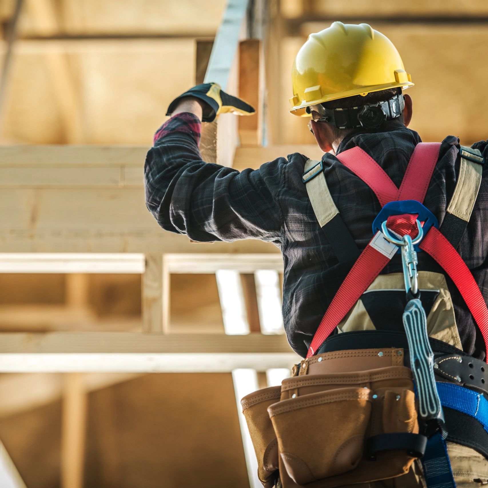 Construction worker wearing safety gear and helmet