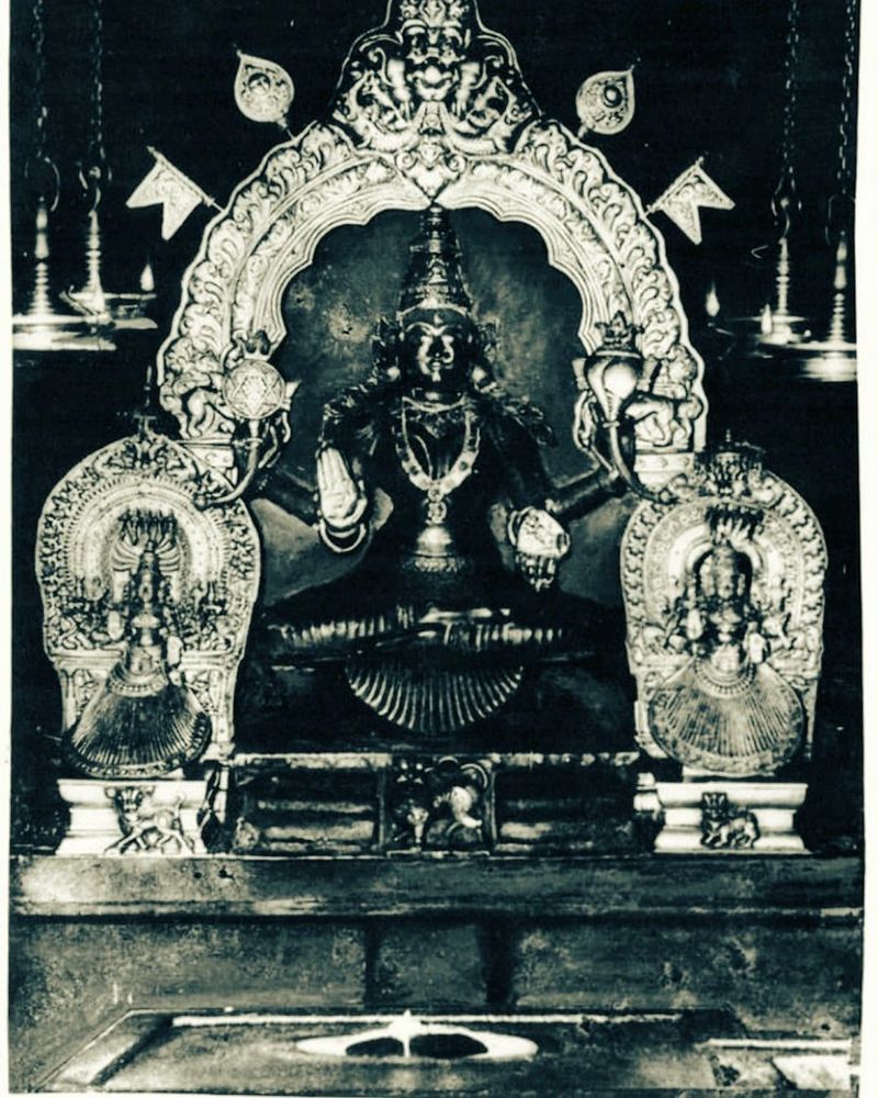 Ancient Hindu deity statue adorned with intricate carvings and ornaments.
