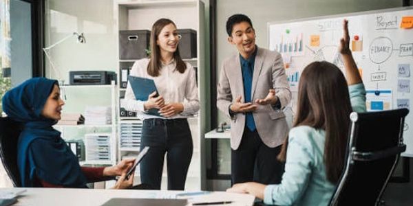 Diverse colleagues collaborating in an office meeting.