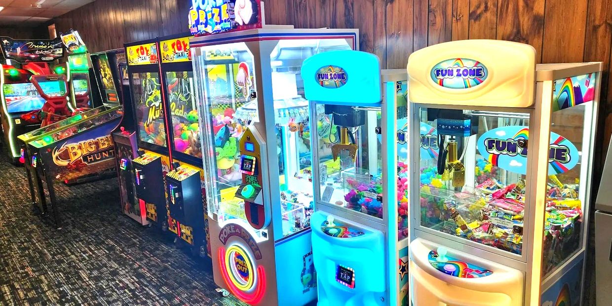 Our arcade offers claw machines, pinball, racing games and more. 
