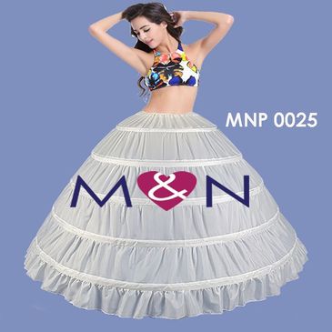 Woman wearing a long hoop skirt and colorful top.