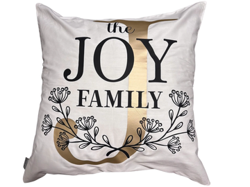 Decorative pillow with the phrase 'the JOY FAMILY' and floral design.