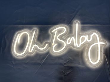 Neon sign glowing with the words 'Oh Baby' in cursive.