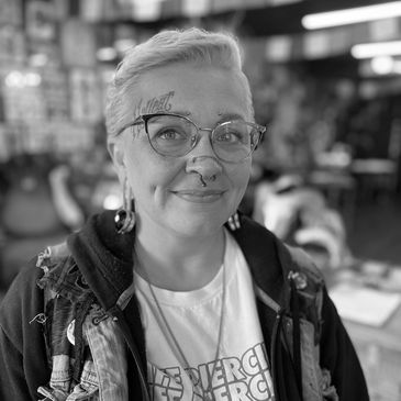 Piercer, Sam Zupanzic, in the lobby of Boise Tattoo