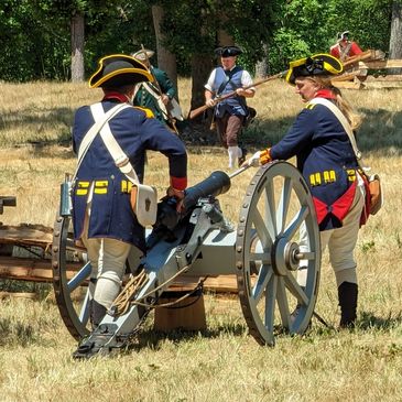 18th century artillery fires at soldiers.