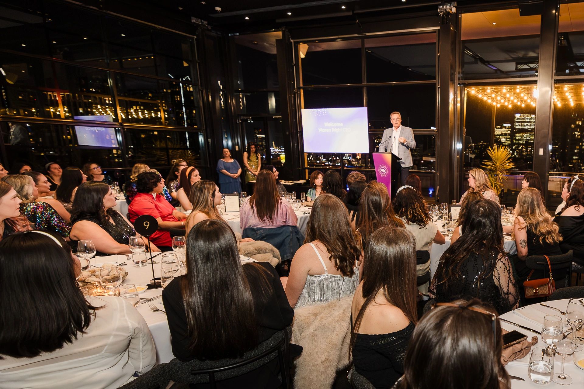 Melbourne corporate event photographer capturing keynote speaker