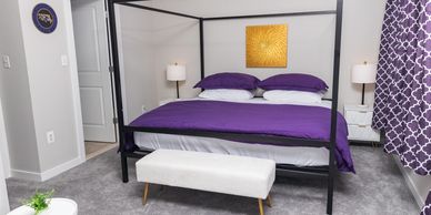Canopy bedframe, quality mattress, warm lighting, blackout curtains, quality pillows and sheets.