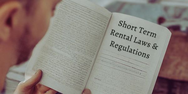 A man trying to read about and navigate short-term rental laws and regulations