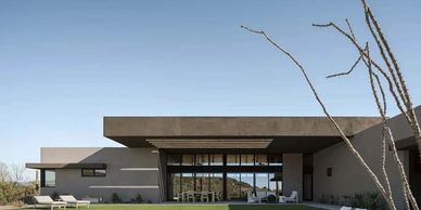 Modern desert home with clean lines and large glass windows.