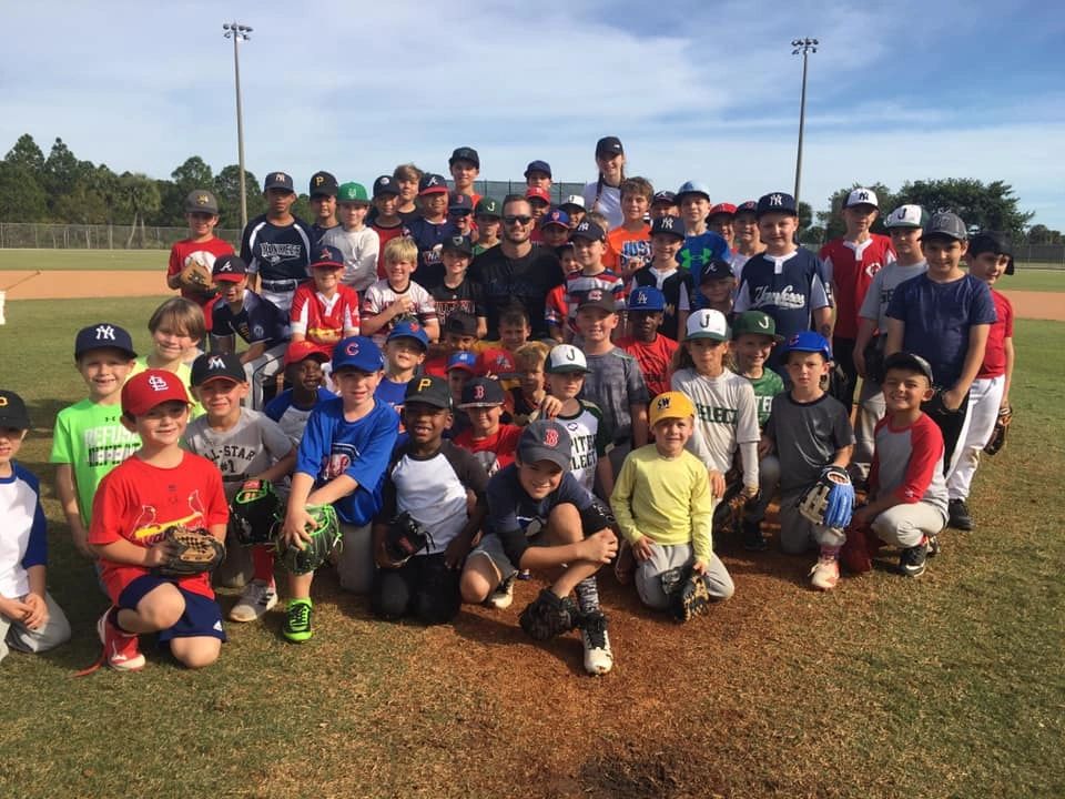 Marlins pitcher Tyler Kinley visited with 75 players at the THBA's 2019 Thanksgiving Camp.