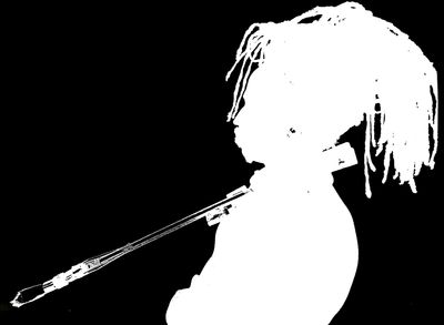 Silhouette of a person playing a flute with dreadlocks against a black background.
