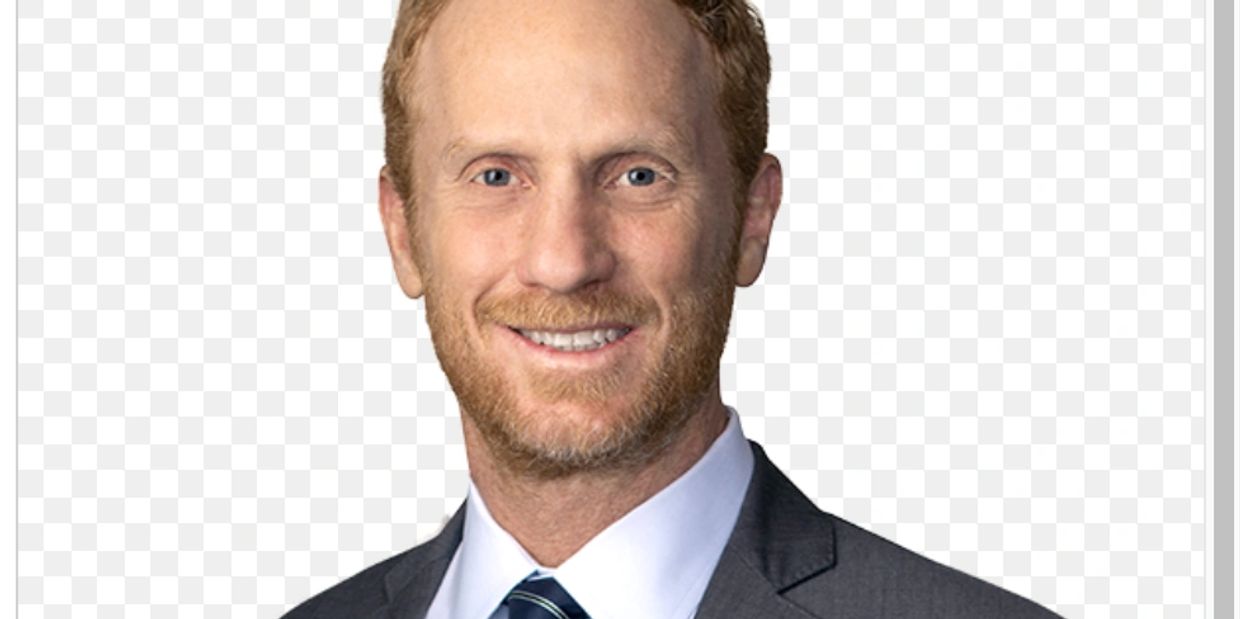 Smiling man in business suit against transparent background.