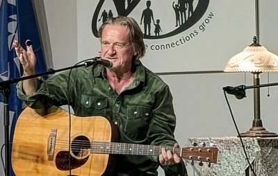 David Storey sharing a song at the coffee house