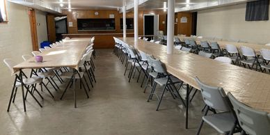 Lower floor, banquet set up. Kitchen area in background