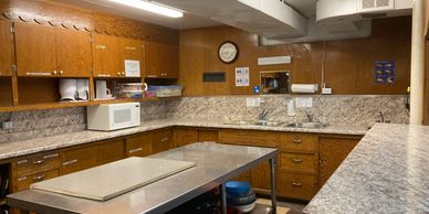 Kitchen area.  Appliances behind photographer.