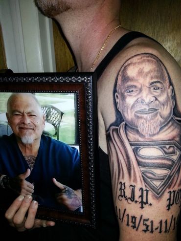 Memorial black and grey portrait tattoo of an older man with lettering,
