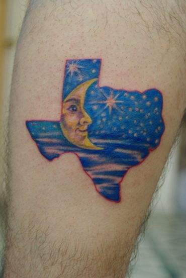Color tattoo of Texas with moon and stars in the center.