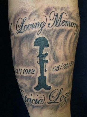 Black and grey military memorial tattoo with lettering.