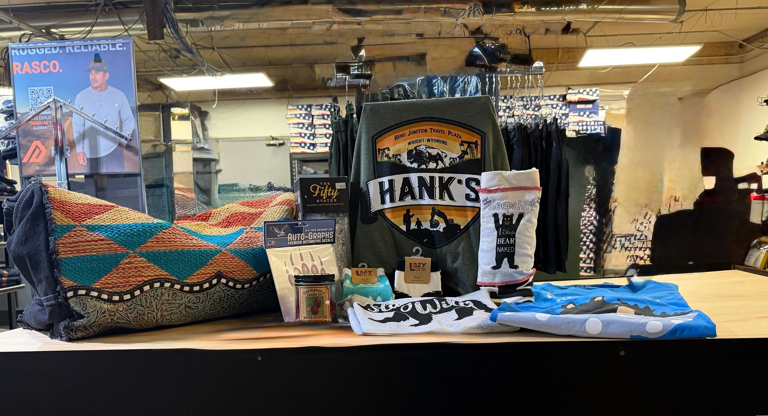 Display of outdoor and casual gear on a counter.