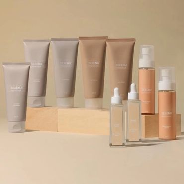 Aesthetic arrangement of skincare products in neutral tones on wooden blocks.
