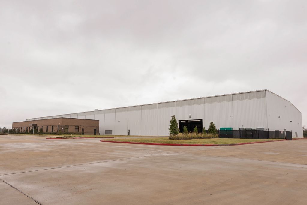 Pre-Engineered metal building with cranes.
