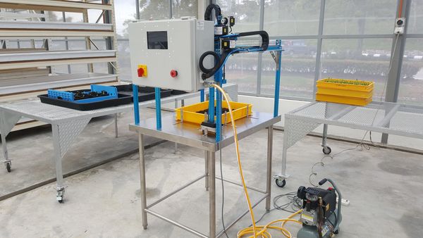 Close-up of a white metal structure behind a window.