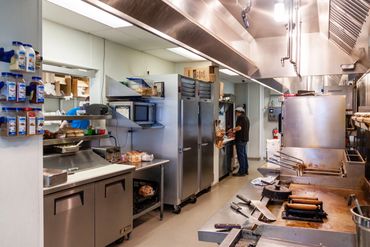 Jim's Grille restaurant kitchen view 

